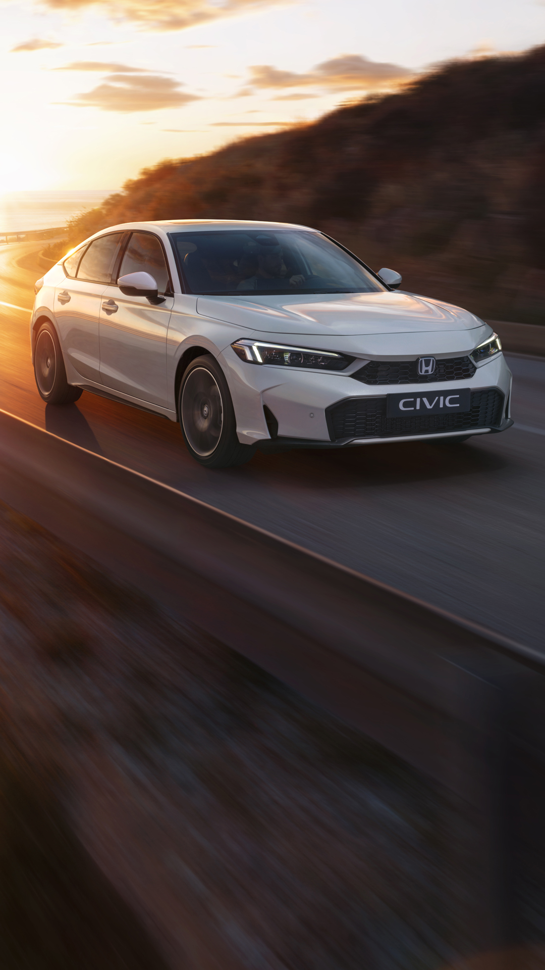 Honda Civic Hybrid driving on a highway