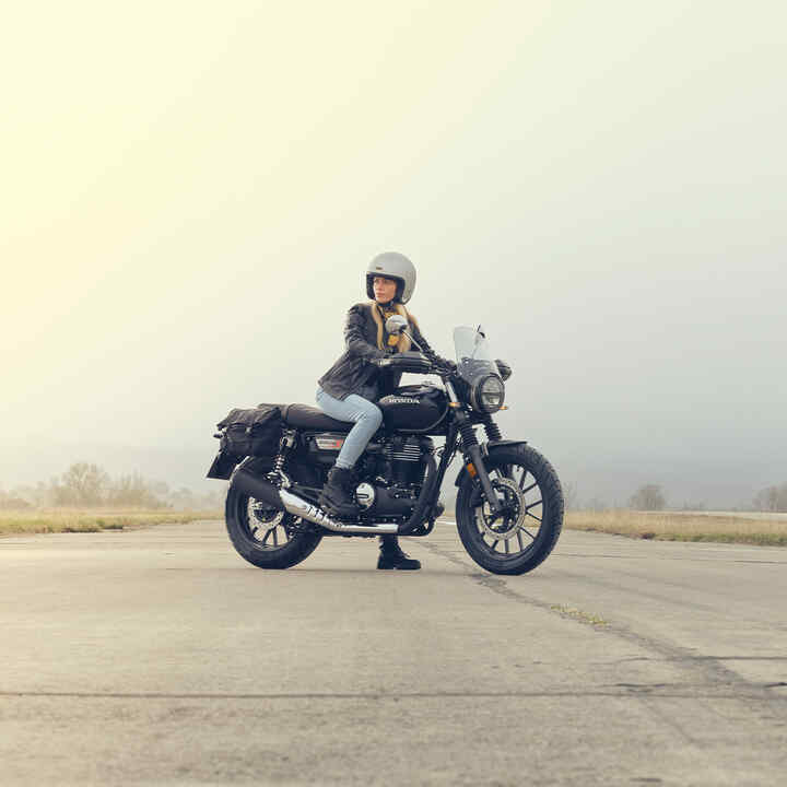 2025 CUV e: front three quarter shot with rider