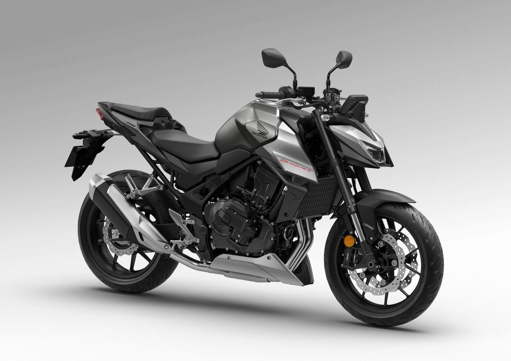 A black and gray Honda CB300R motorcycle, a naked sport bike model, shown in profile view against a light gray background. The bike features angular bodywork, exposed frame, upright handlebars, and a compact design typical of the CB series.